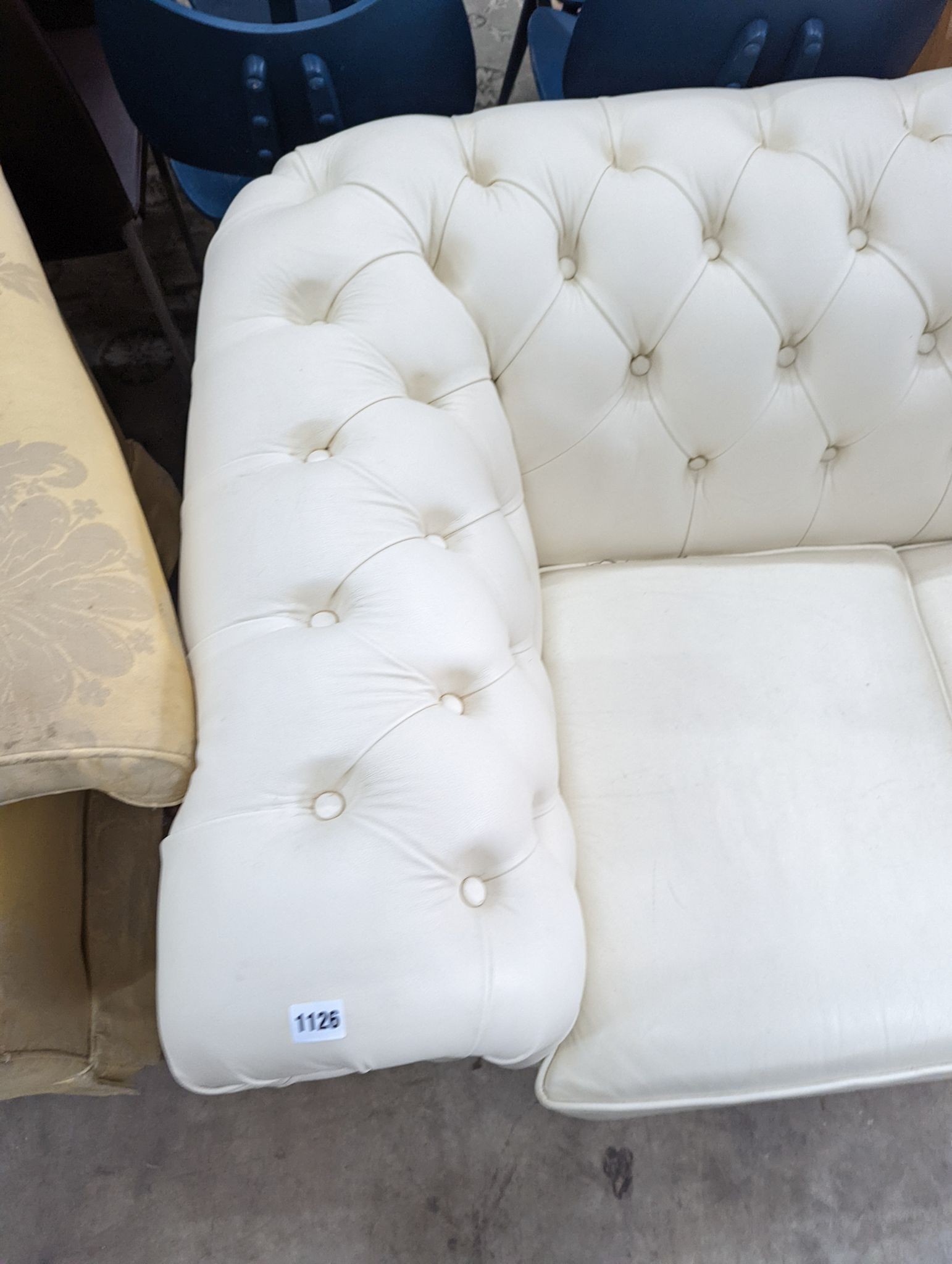 A Victorian style buttoned white leather Chesterfield settee, length 190cm, depth 86cm, height 72cm